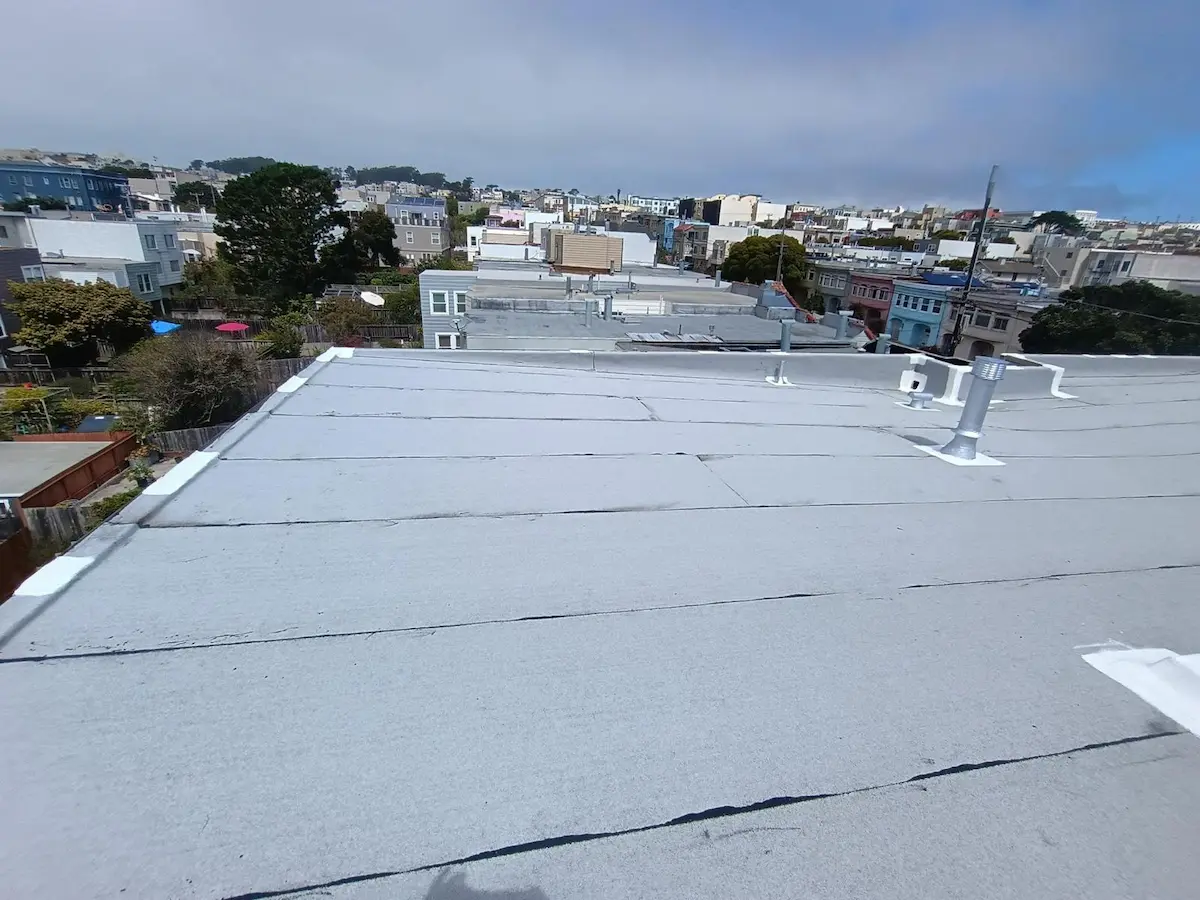 Finished flat roof repair on a San Francisco Bay Area home, showing a completed TPO membrane roofing system.
